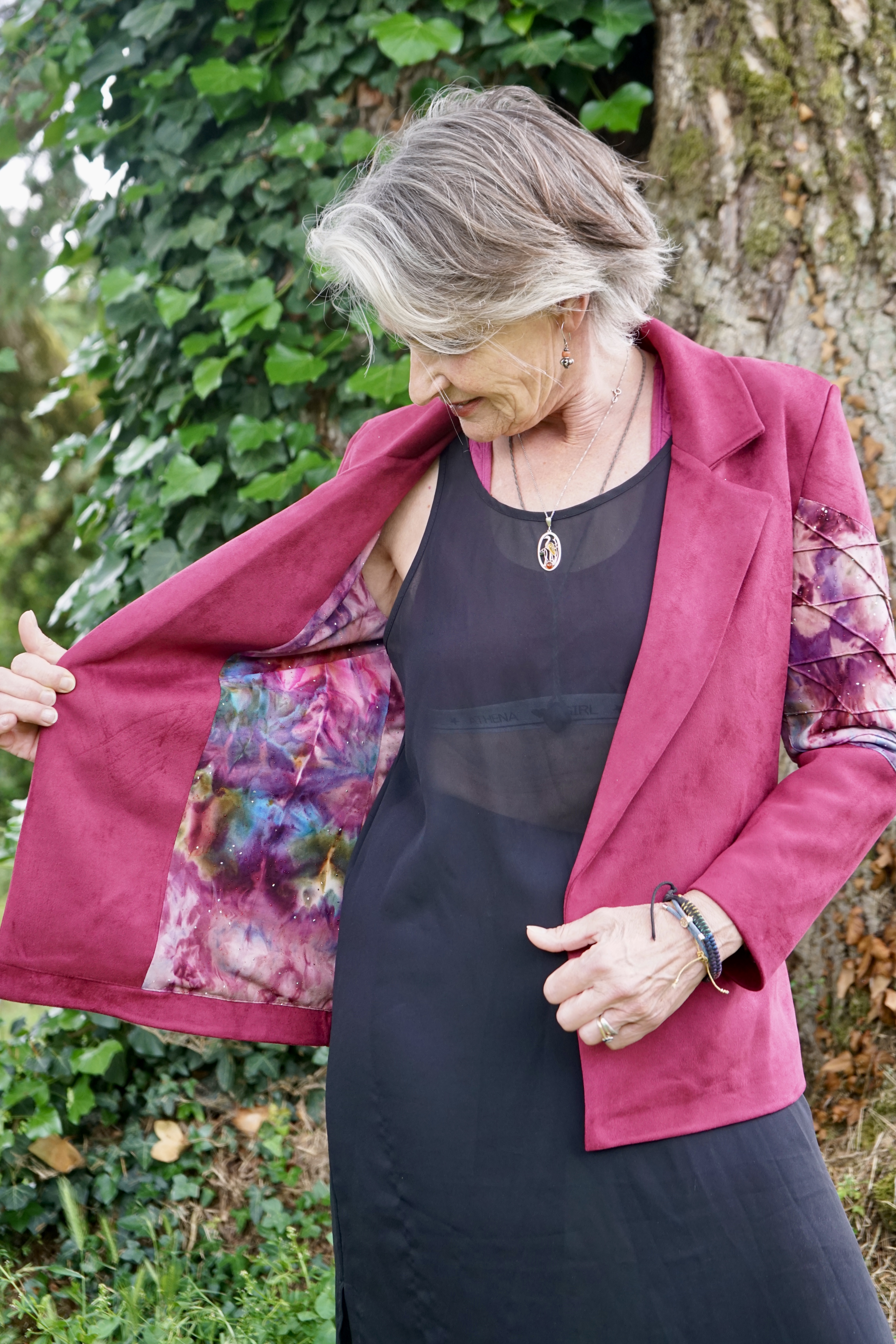 Interior lining of red velvet jacket on black dress outfit